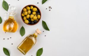 Olive oil bottle and olives